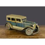 A Karl Bub clockwork tinplate Limousine, lithographed teal and pale green with yellow lining,