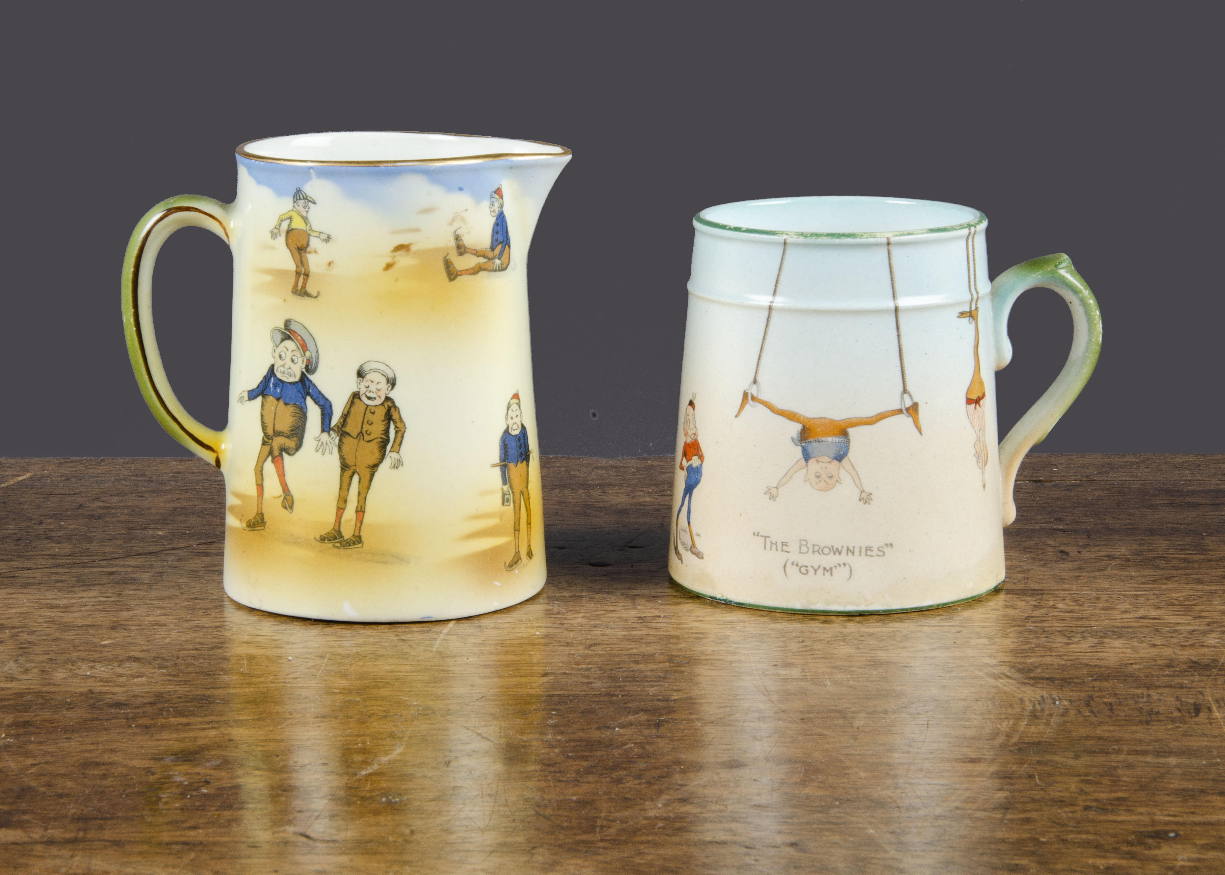 A Grimwades Brownie mug and jug,  a mug featuring Brownies in the Gym —3¼in. (9cm.) high (restored