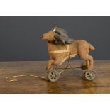 An early stag on wheels 1910-20s, of brown brushed cotton, cream belly, clear and black glass