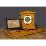 An oak mantel clock, with inlay banding —12½in. (32cm.) high; an oak tray; a pen wipe; a framed