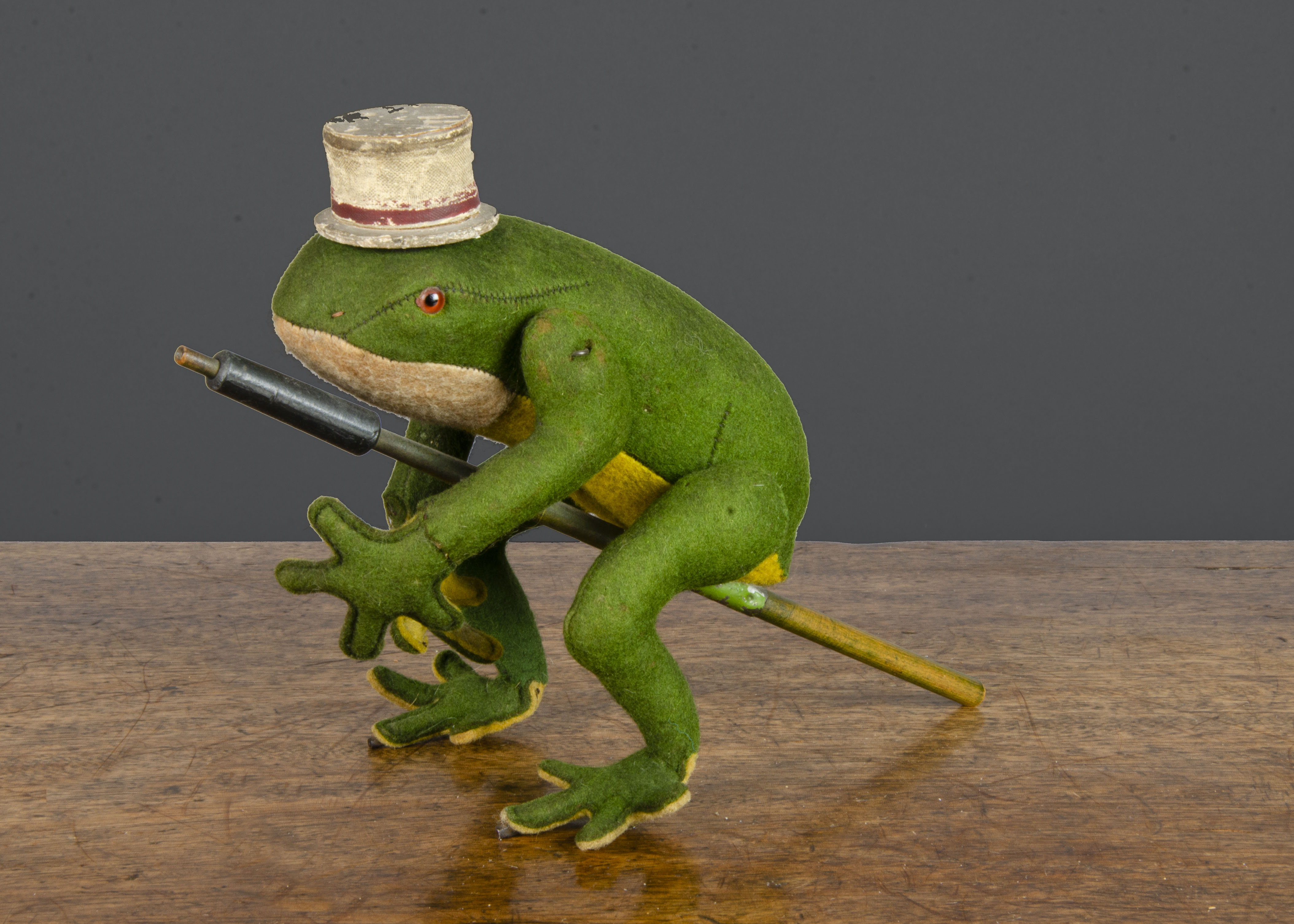 A rare Bing clockwork leaping felt frog 1910-20s, dark green felt with yellow belly and white