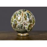 A découpage glass sphere, the clear glass ball interior applied with chromolithographic scraps and