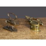 A miniature toy brass charcoal iron, with turned wooden handle —2in. (5cm.) long; two iron toy