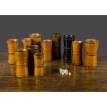 Eleven turned wood dice shakers, mainly 19th Century, waisted, various woods including an ebony