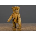 A rare early Bing clockwork small size walking teddy bear circa 1910, with brown mohair, black