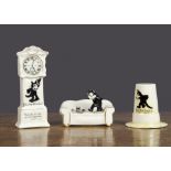 Three pieces of Felix the Cat crested china, a Carlton China sofa with Felix walking on the seat and