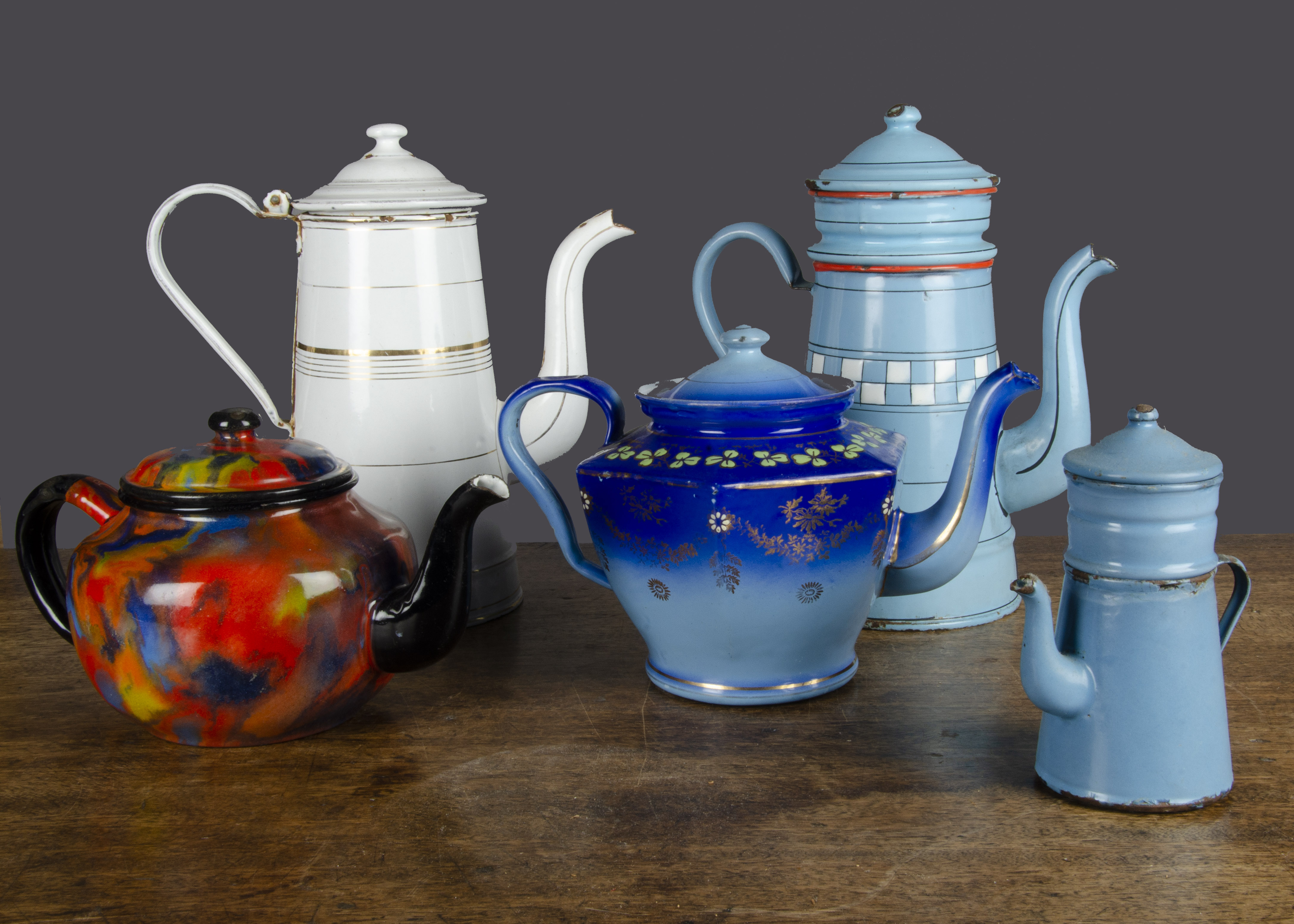 Enamel tea and coffee pots, a shaded blue tea pot decorated with clover and gilding —6½in. (16.5cm.)