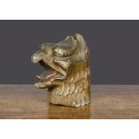An interesting carved wooden and gold-painted griffin head, with open mouth and tongue, probably