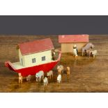 A small Erzgebirge wooden Noah’s Ark, painted cream, red and brown with lift-off roof section —6¼in.