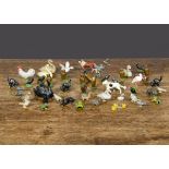 A selection of small farm and domestic animals and birds by various makers including Britains and