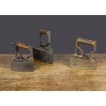 Three 19th Century British iron box irons, two impressed Bate on gate, with turned wooden handles —