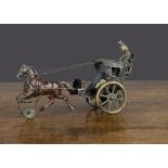 A German clockwork painted tinplate hansom cab, possibly Günthermann with brown trotting horse on