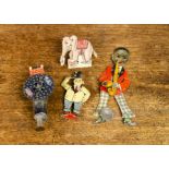 German tinplate novelties, a push-operated sparkling toy with top hatted man appearing from