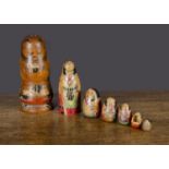 A Fukuruma or Matryoshka seven-piece Japanese Samurai nesting dolls, turned wood and hand-painted —