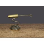 An unusual 19th Century small brass and cast-iron goffering iron, with decorative base and cast-iron