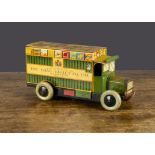 A Chad Valley clockwork tinplate delivery lorry, lithographed green with yellow lining, Chad