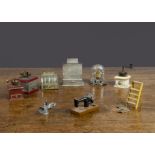 Three dolls’ house tinplate coffee grinders, all with working handles, two with working drawers —2½