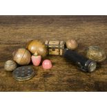 The Smallest Doll in the World, a pegged-wooden doll in a turned wooden pink painted egg —1¼in. (