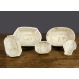 Five creamware moulds, internal moulding comprising ewe and lamb —6¾in. (17cm.) wide (repairs); a