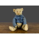 An early Steiff teddy bear circa 1909, with blonde mohair, black boot button eyes, pronounced