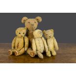 Four German 1920/30s teddy bears, all with gold mohair and slotted in ears, smallest —8½in. (21.