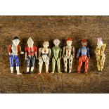 Seven composition jointed character dolls, pegged string-jointed, including Mr Punch, Grimaldi, a