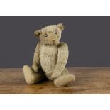 An early British white mohair teddy bear, probably early Farnell or similar, black flat boot