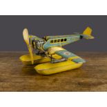 A Distler clockwork tinplate Seaplane, lithographed blue and yellow with British roundels, two