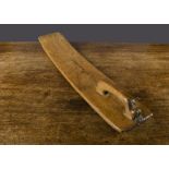 An early wooden mangle board dated 1671, probably Norwegian, the handle carved as an animal, the