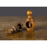 An intricately carved wooden screw-action nutcracker, similar to a baby's bonnet —4in.(10cm.)