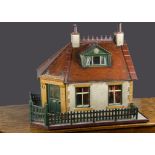 ’May Cottage’ dolls’ house, a chalet bungalow with front door on corner, grey and tan painted