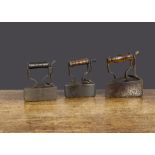 Three 19th Century British iron box irons, one impressed F Perks 3½ with turned wooden handle —