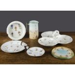 Broken and damaged Brownie china,  a hors d'oeuvre dish, a pot stand, a baby plate, a jug —6¼in. (