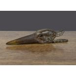 A cast-iron heron's head paper clip, with black boot-button eye —6in. (15.5cm.) long (gilt finish