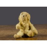 A Farnell ’soldier’ teddy bear, with golden mohair, black stitched nose and eyes, pipe cleaner ears,