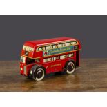 A Wells Brimtoy Double Deck Bus, clockwork, red lithographed tinplate, people at windows and various