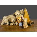 Various teddy bears and soft toys, a Steiff 1950s bear on all fours with button —8in. (20.5cm.)