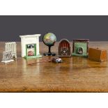 Dolls’ house items, a soft metal toaster, a DCA sewing machine and cover, two lead fireplaces, a