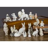 Bisque figures and cake decorations, a pin-jointed minstrel doll —3¼in. (8cm.) high (missing one