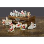 Bisque Father Christmas cake decorations, a Christmas cracker car 6861 —4in. (10cm.) long, two