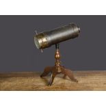 A Charles G Bush & Co (American) kaleidoscope, card covered in black textured paper, brass end