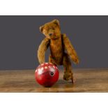 A rare Bing clockwork teddy bear with ball circa 1910, with brown mohair, pronounced clipped muzzle,