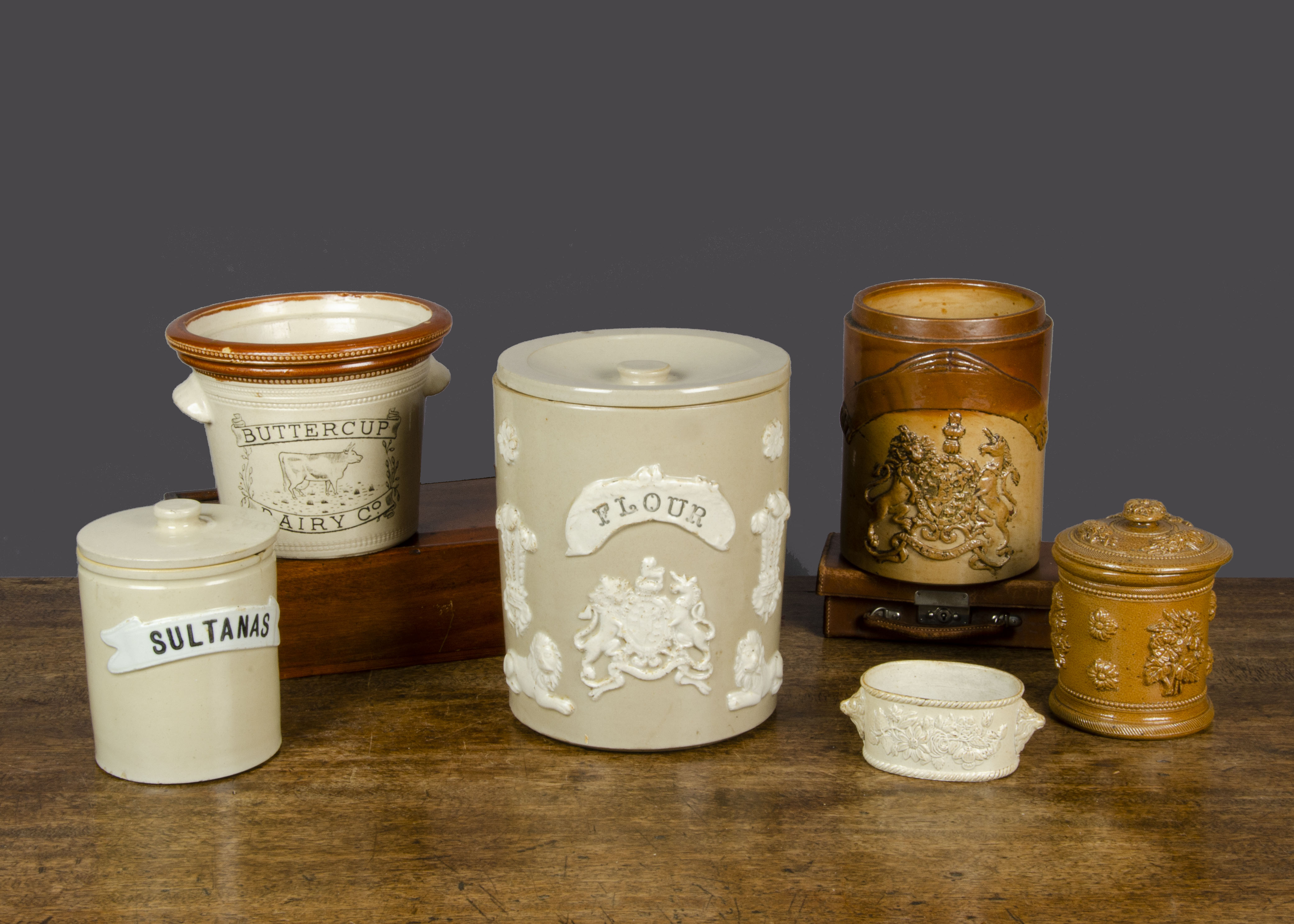 A salt-glazed stoneware ‘Flour’ bin, with applied coat of arms, two Prince of Wales' feathers, two