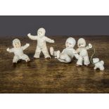 Bisque Snow Baby cake decorations, the largest fallen onto her back —3in. (7.5cm.) long; another