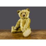 A good J K Farnell 1920s teddy bear, with golden mohair, orange and black glass eyes, pronounced