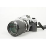 A Nikon FM SLR Camera, chrome, serial no 3248927, shutter working, meter responsive, timer