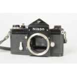 A Black Nikon F Eyelevel SLR Body, serial no. 7 168 836, body F-G, brassing to some edges, slight