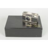 A Nikon 35Ti Quartz Date Compact Film Camera, titanium body, serial no. US 4 016 711, body VG,