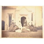 Various Images, group of ladies, most in crinolines, in front of 1840s Gothic Revival stucco