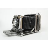 A Linhof Super Technika 4 x 5in Model V Folding Field Camera, serial no. 2 112 851, body G, with a